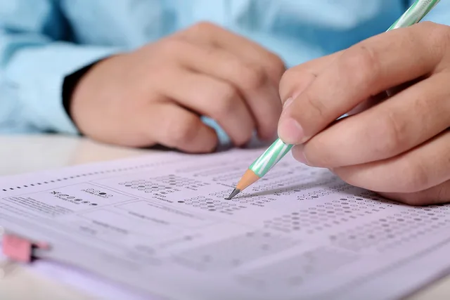 man, men, hand, person, people, male, portrait, human, adult, business, young, fill, sheet, paper, pencil, work, office, educate, exam, circle, filed, picture, desk, table, exam, exam, exam, exam, exam. How skill assessments report scores: raw, scaled, percentile and cut score